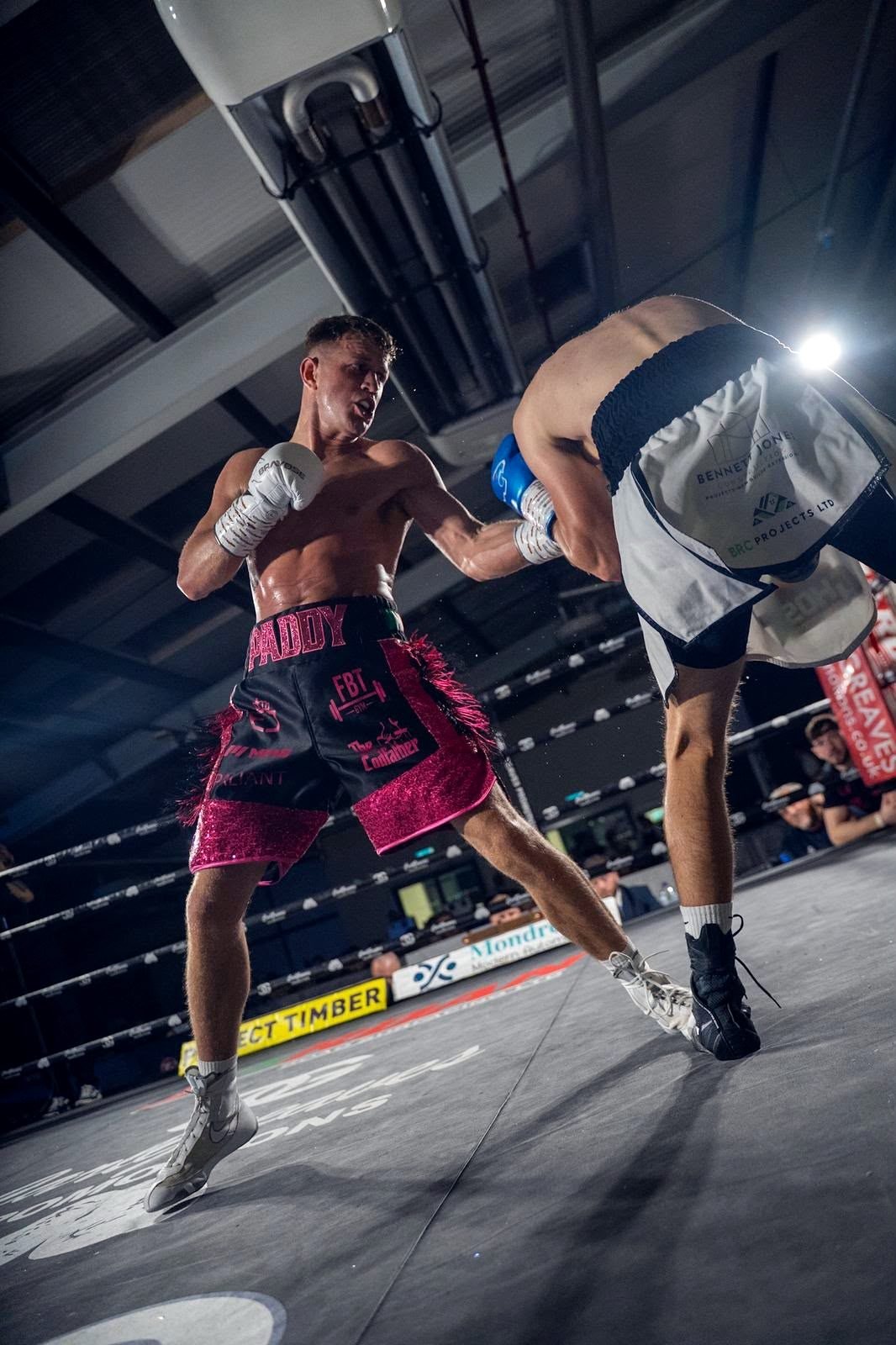 Paddy Walsh landing a punch at close range